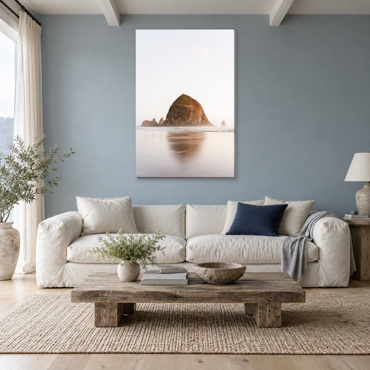 Haystack Rock print from Cannon Beach, Oregon displayed in a coastal living room, without a frame; room mockup.