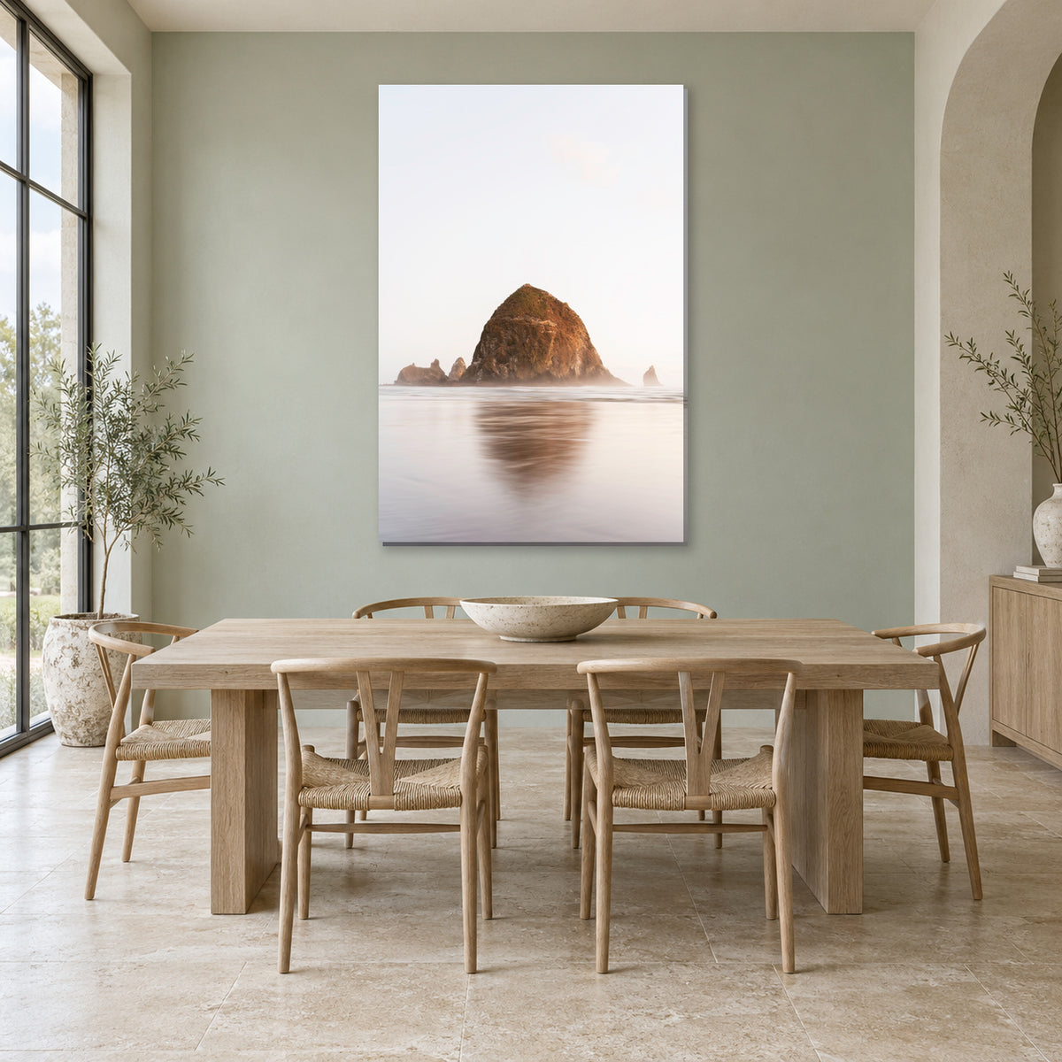Haystack Rock print from Cannon Beach, Oregon displayed in a sea glass dining room, without a frame; room mockup.